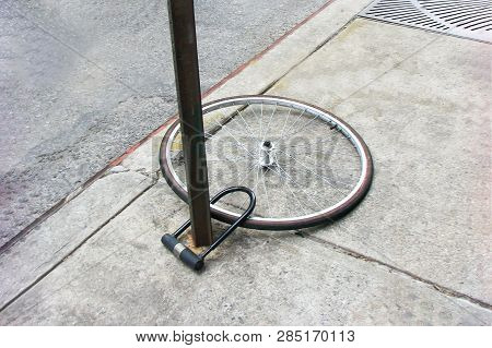 Bike Wheel With Padlock. Theft Of A Bicycle. Bicycle Stolen And Left Only Wheel.