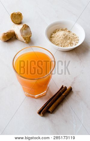 Jamu Healthy Asian Drink With Turmeric And Cinnamon Stick, Orange Juice