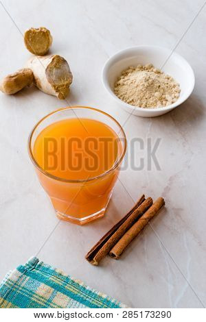Jamu Healthy Asian Drink With Turmeric And Cinnamon Stick, Orange Juice