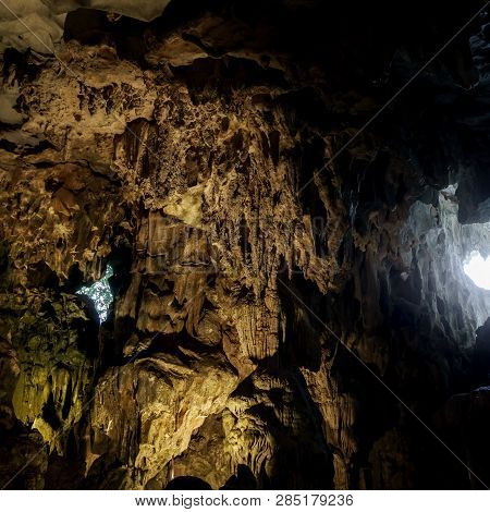 Cave Deep Dark Inside Near Entrance. Underground Of Stone Rock Mountain. Ha Long Vietnam Nature Back