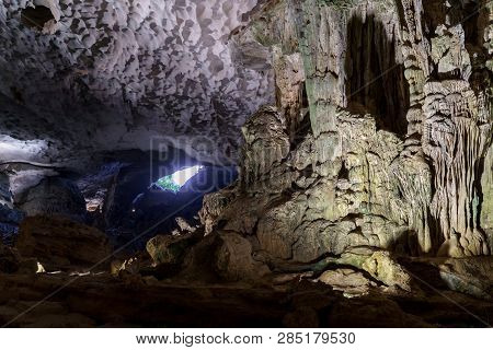 Cave Deep Dark Inside Near Entrance. Underground Of Stone Rock Mountain. Ha Long Vietnam Nature Back