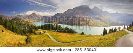 Mountains And Lake Roselend  With A Dike