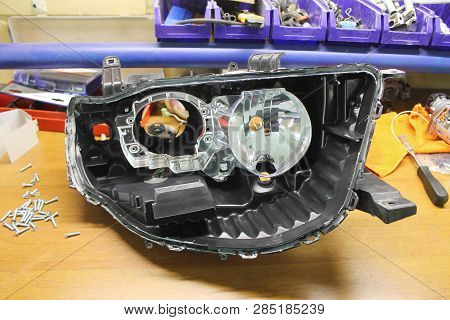 Macro View Of Repairing, Installation And Turning Headlight Of Modern Automobile And Car Projector L
