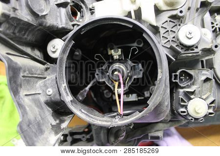 Macro View Of Repairing, Installation And Turning Headlight Of Modern Automobile And Car Projector L
