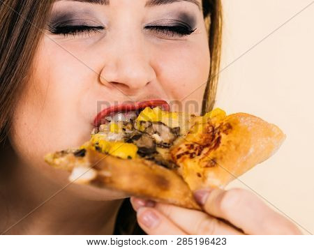 Woman Eating Hot Pizza Slice