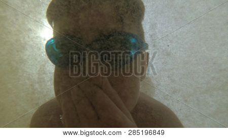 Funny Boy Swims Underwater In The Salty Sea In Swimming Glasses
