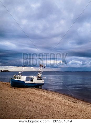 Fishing Boat On Baltic Sea Coast. Stormy Weather. Mechelinki, Poland, Pucka Bay.