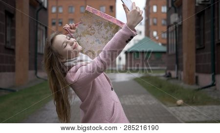 Young Happy Blonde Girl After Shopping Doing Selfie With Bright Packages