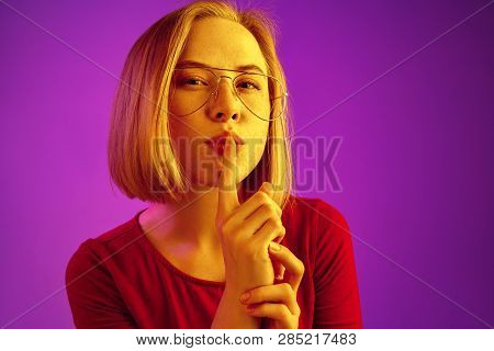 Secret, Gossip Concept. Young Woman Calling For Silence. Businesswoman Isolated On Trendy Neon Studi