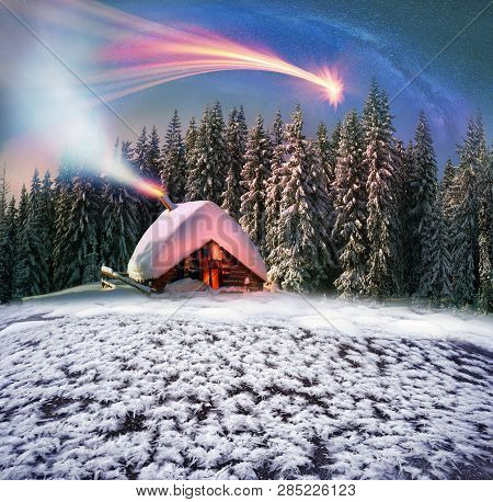 Climbing To Tourist Wild Alpine Mountain To An Abandoned Cabin-in Order To Illuminate The Snow-cover