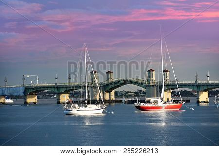 St. Augustine, Florida. January 25 , 2019. Sailboats And Bridge Of Lions On Sunset Sky Background At