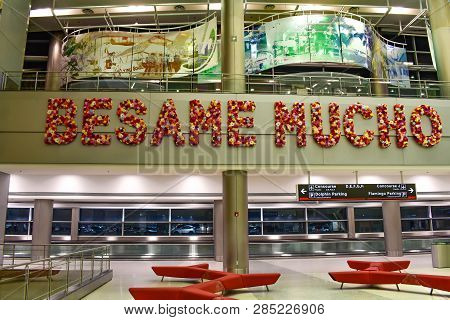 Miami, Florida. January 05, 2019. Sign Flower Besame Mucho And  Minimalist Armchairs At Miami Intern