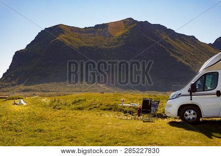 Camper Van Motor Home On Sea Coast In Summer. Camping On Nature. Lofoten Archipelago Norway. Vacatio