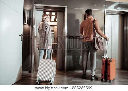 Blonde-haired Wife Saying Bye To Her Husband Leaving For Business Trip