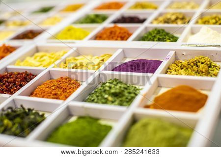 Spices And Herbs In Small Glass Bowls.