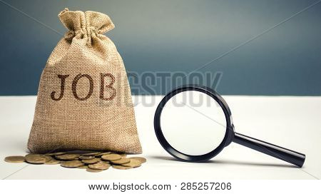 Money Bag With The Word Job And A Magnifying Glass. Work Search Concept. Available Job Vacancies. Hi