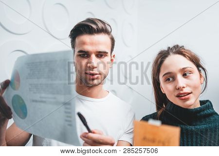 Portrait Of Coworker People Standing At Office Space Behind Glass Wall With Sticky Notes. Team Of Ma