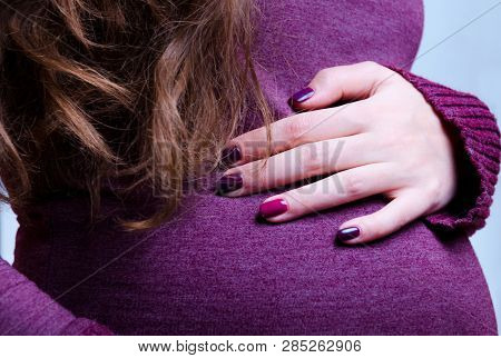 A Portrait Of Caucasian, Pregnant Woman Stay In Studio, Close Up On The Stomach. Hand With Manicure 