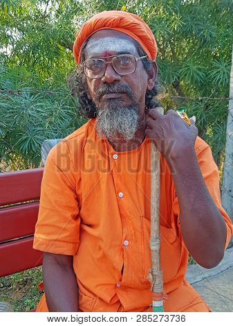 Tiruvanamalai, India - January 5, 2019:  Indian sadhu in the streets from Tiruvanamalai in India