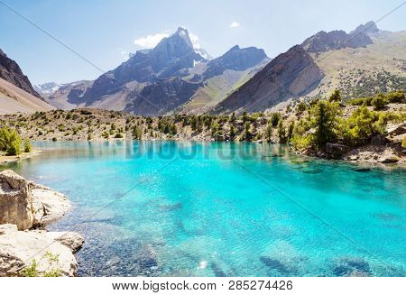 Beautiful serene lake in  Fanns mountains (branch of Pamir) in Tajikistan.