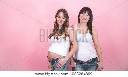 Maternity Concept, Two Pregnant Women With An Open Tummy