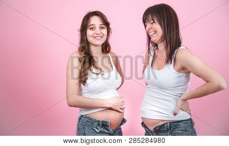 Maternity Concept, Two Pregnant Women With An Open Tummy