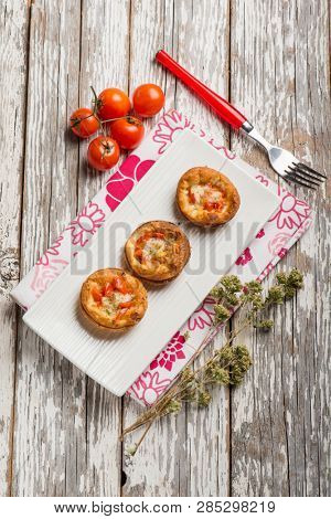 mini pizzas with tomatoes mozzarella and oregano