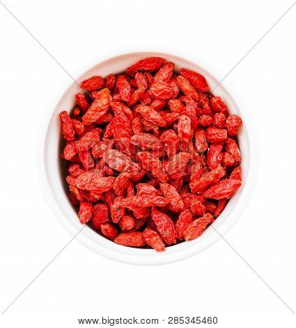Dried Goji Berries In White Bowl Isolated On White Background, Save Clipping Path.