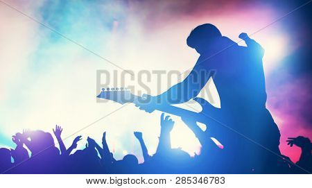 Man performing on music concert. Cheering crowd, fans, entertainment. Music industry. 3D illustration.