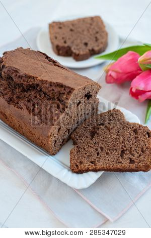 Home Made Chocolate Cake With Tulips On An Easter Table