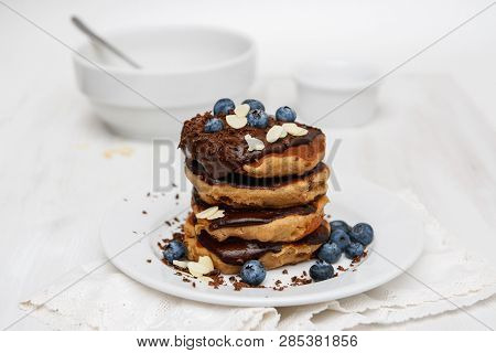 Eggless Pancakes For Breakfast With Blueberries And Chocolate Sauce