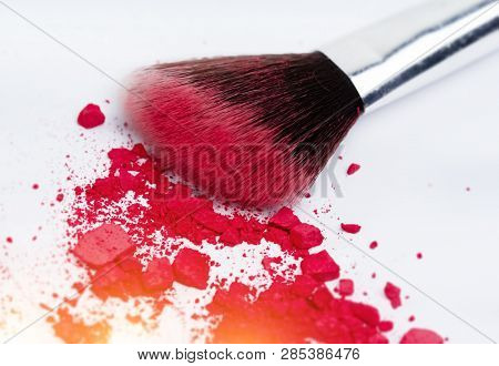 In Selective Focus Of Blush Stroke Isolated .show Pigment ,texture And Color Of Blush Cheek And Eyes