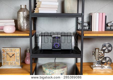 Compact Cd Radio Player On The Shelf In The Vintage Interior Of The Living Room