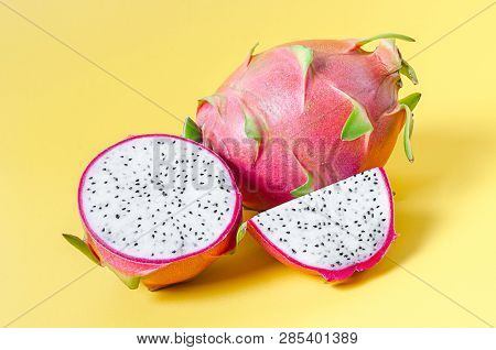 Fresh Dragon Fruit Slice On Yellow Background.