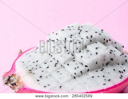 Fresh Dragon Fruit Slice On Pink Background.