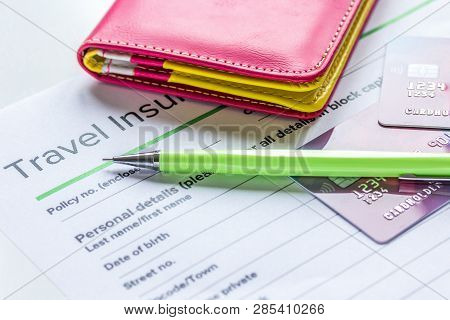 Travel Insurance Application Form On White Desk Background