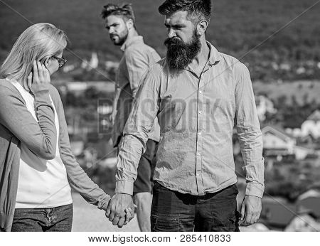 Husband Strictly Watching His Wife Looking At Another Guy While Walk. Jealous Concept. Man With Bear