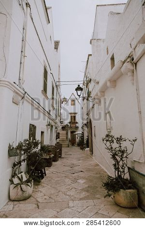 Narrow White Street In Locorotondo Oldtown, Province Bari, Sauthern Italy