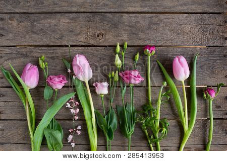 Fresh Pink Spring Flowers On Old Rustic Wood For Mothers Day