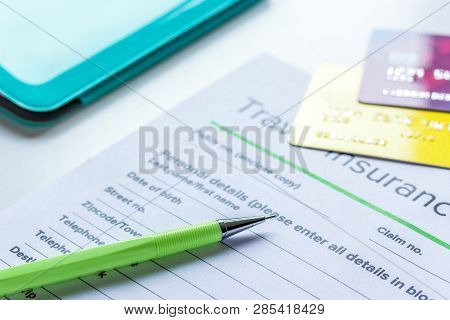 Booking Travel Concept With Insurance On Table Background