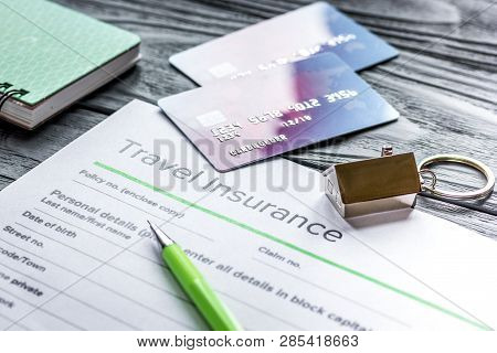 Travel Preparation Concept With Insurance And Cards On Wooden Table