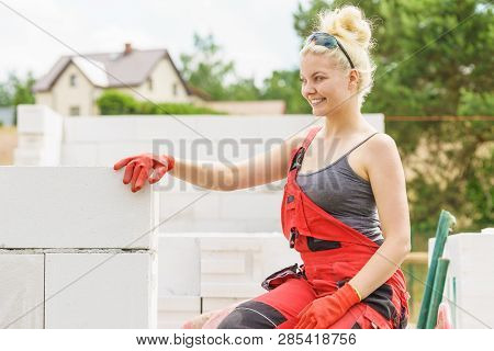 Woman Taking Break On Construction Site