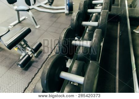 Rows Of Dumbbells In The Gym With Hign Contrast And Monochrome Color Tone