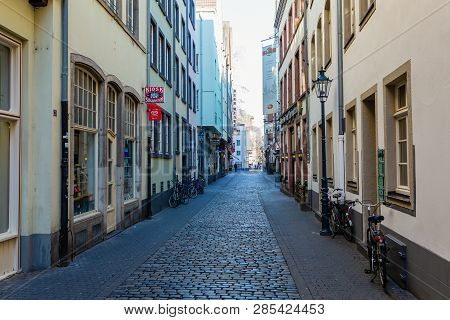 Narrow Alley In The Historic Old Town Of Cologne, Germany