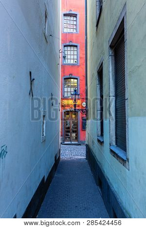 Narrow Alley In The Historic Old Town Of Cologne, Germany