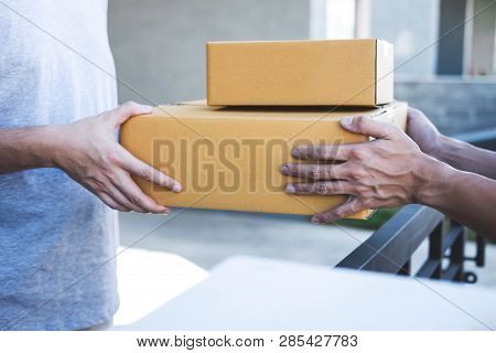 Delivery Mail Man Giving Parcel Box To Recipient, Young Owner Accepting Of Cardboard Boxes Package F