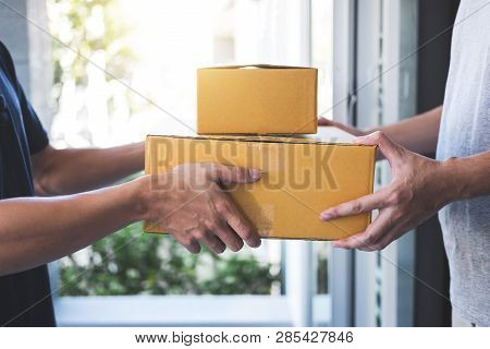 Delivery Mail Man Giving Parcel Box To Recipient, Young Owner Accepting Of Cardboard Boxes Package F