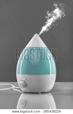 White-blue Air Humidifier. The Unique Design Quickly And Effectively Eliminates Dry Air, Providing A