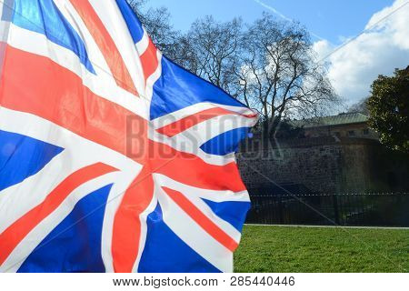 Union Jack Flag Flying Over Grass At Parliament Square London