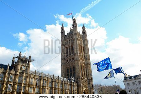 E.u. Flag Flying In Front Of Union Ack Flag At Houses Of Parliament London